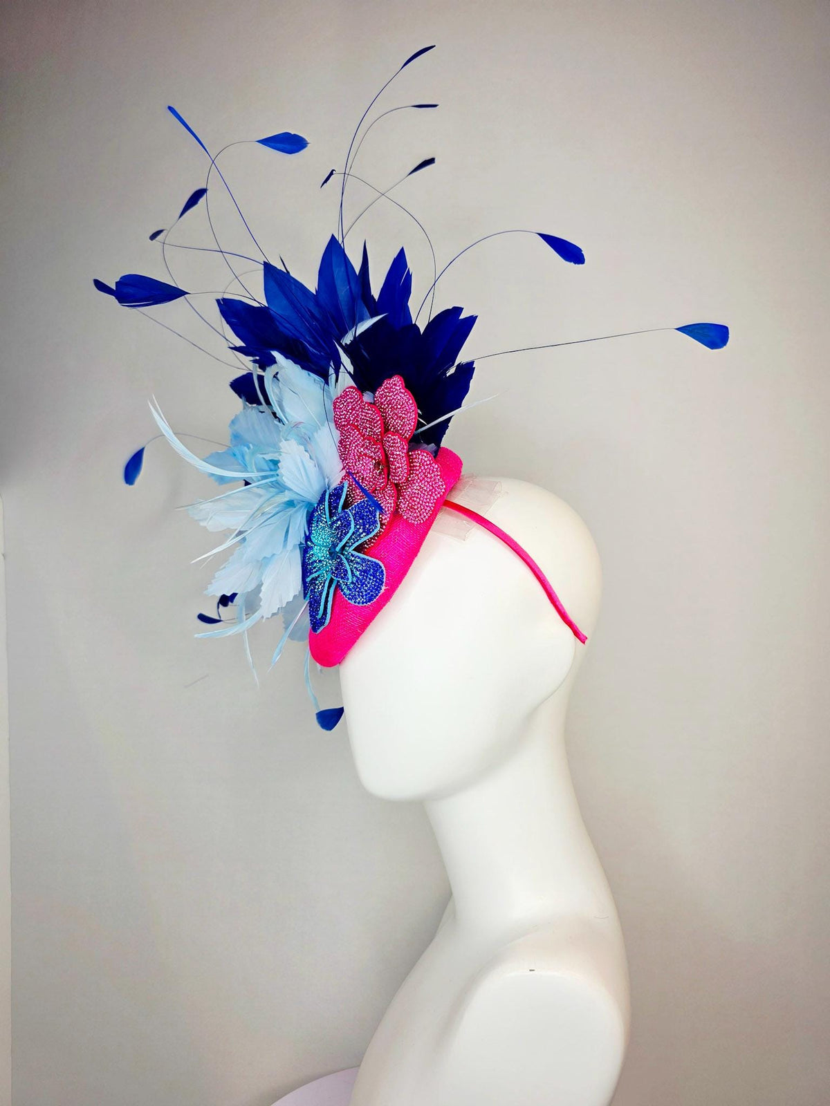 kentucky derby hat fascinator hot pink sinamay with pink and blue crystal rhinestone flowers and fluffy light blue royal navy blue feathers