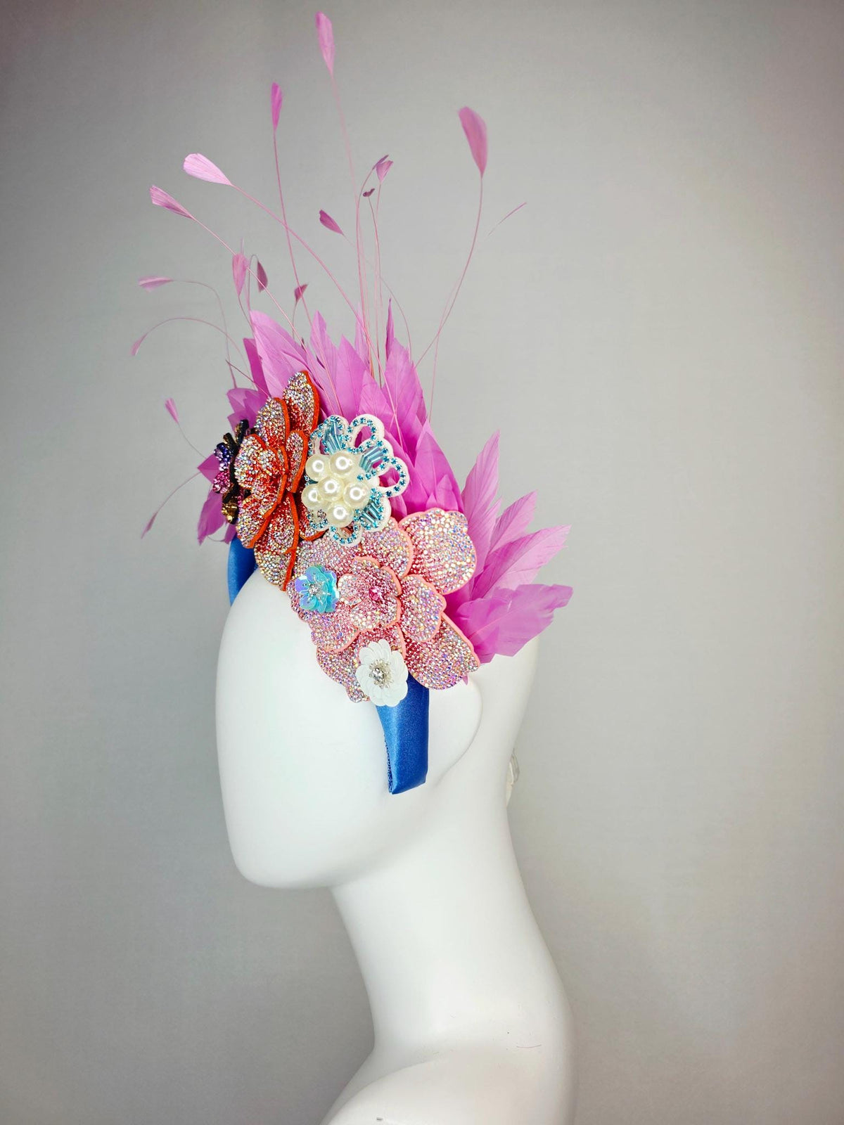 kentucky derby hat fascinator sky blue satin headband with iridescent pink orange blue gold pearl crystal flowers and blush pink feathers