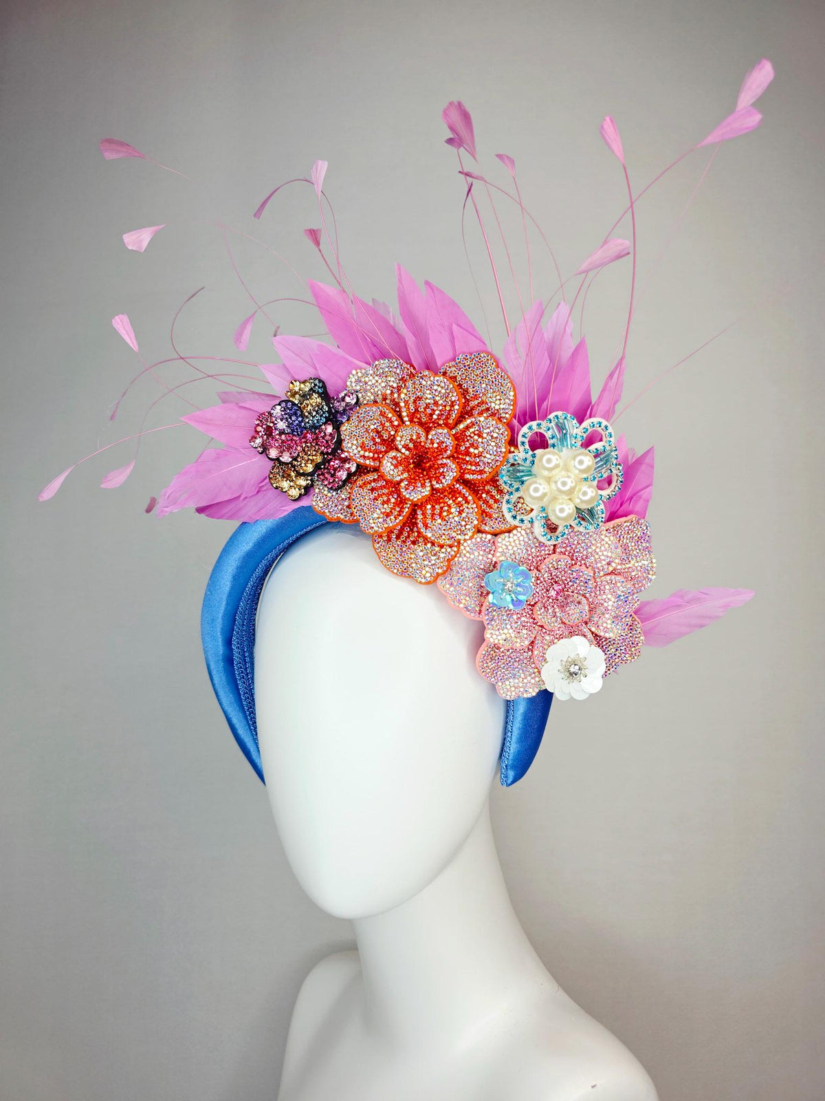 kentucky derby hat fascinator sky blue satin headband with iridescent pink orange blue gold pearl crystal flowers and blush pink feathers
