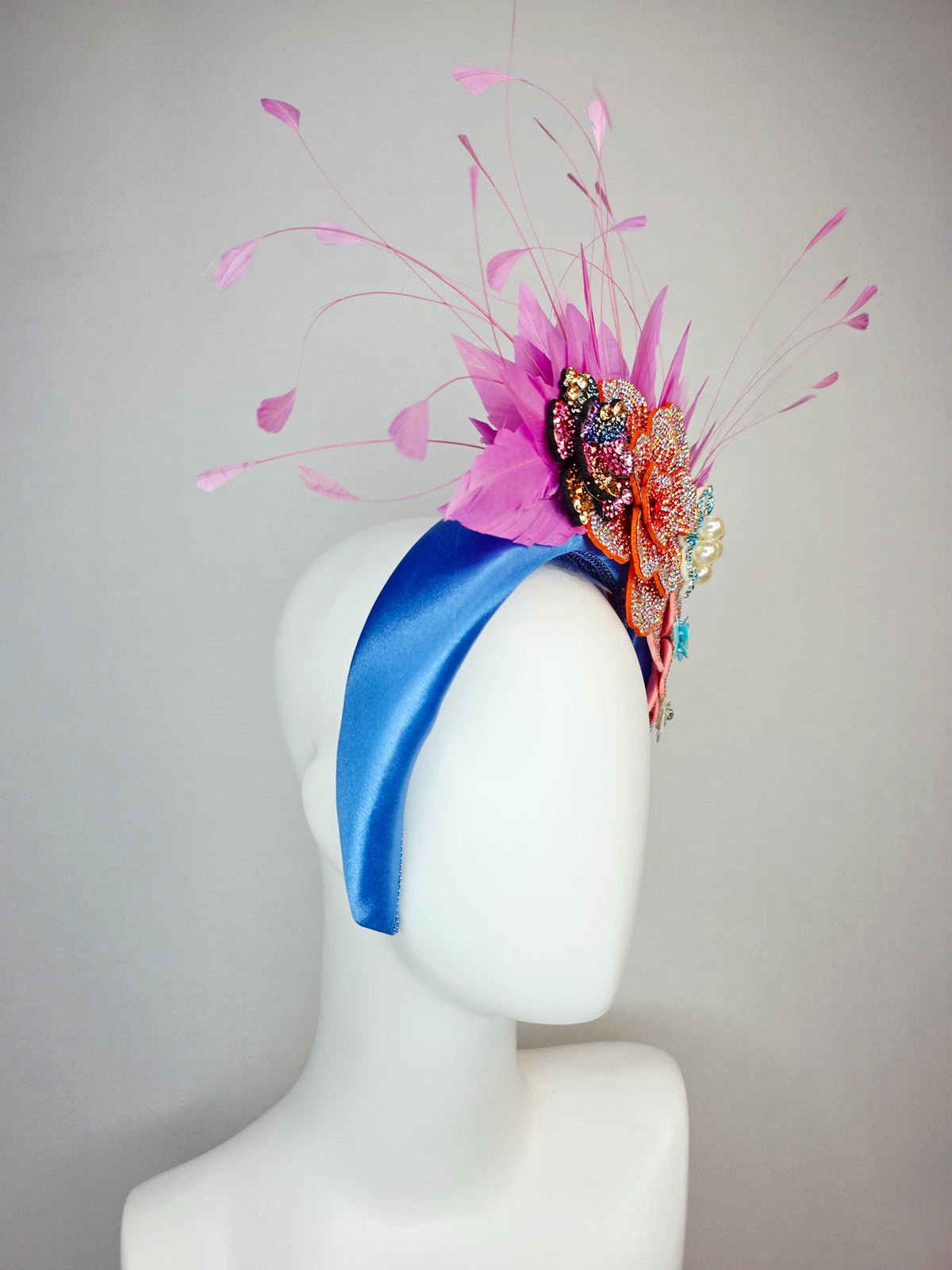 kentucky derby hat fascinator sky blue satin headband with iridescent pink orange blue gold pearl crystal flowers and blush pink feathers