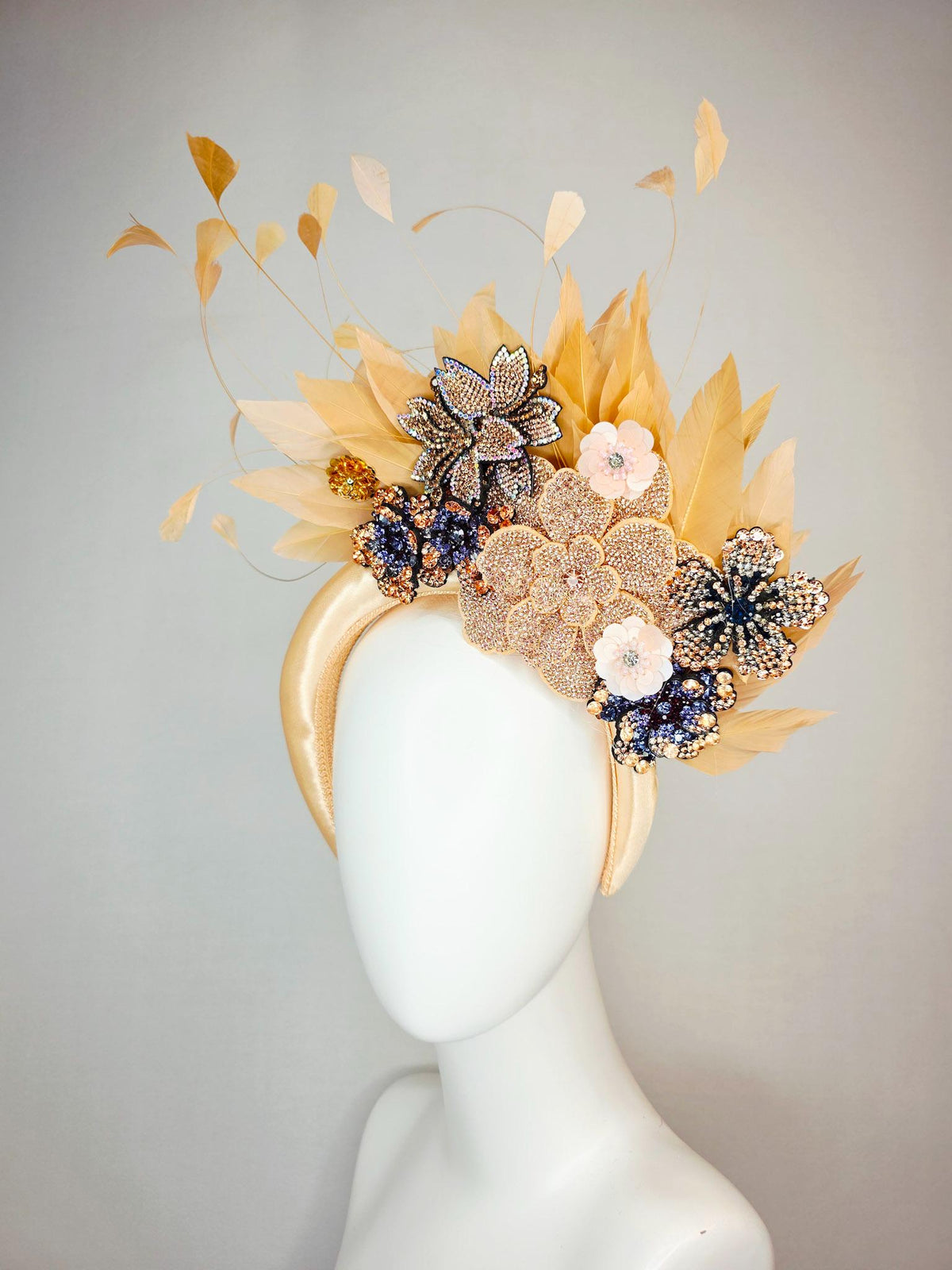 kentucky derby hat fascinator champagne gold satin headband with navy blue gold ivory crystal rhinestone flowers and tan beige gold feathers