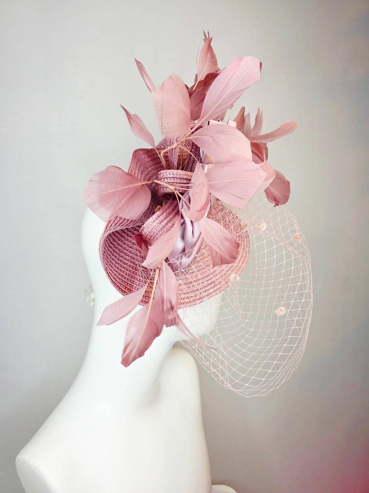 kentucky derby hat fascinator dusty mauve pink straw saucer with lilac pink satin bow dusty pink branching feathers light pink mesh veil