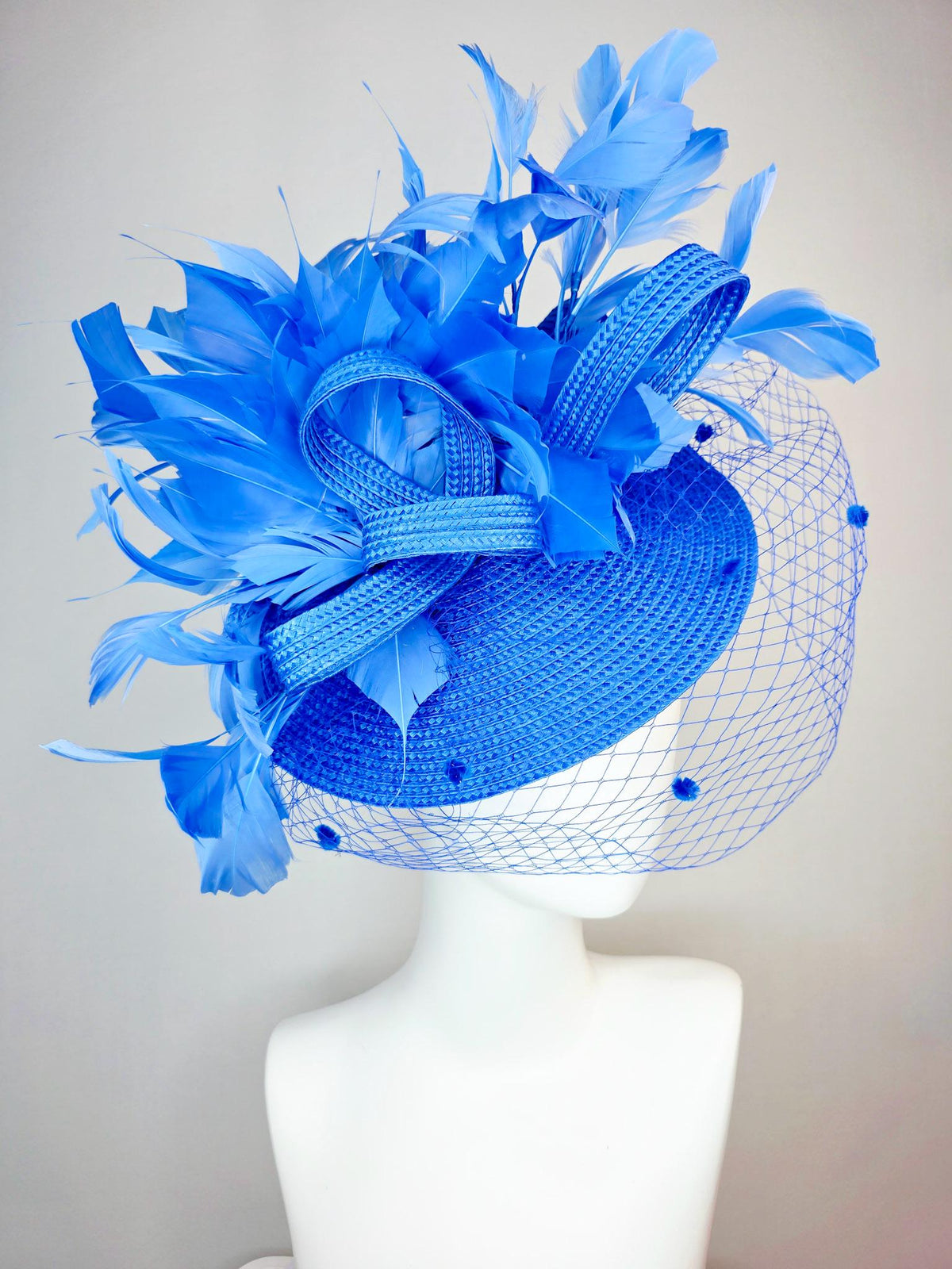 kentucky derby hat fascinator cobalt blue straw saucer with cobalt blue straw bow royal blue feathers and cobalt blue mesh veil
