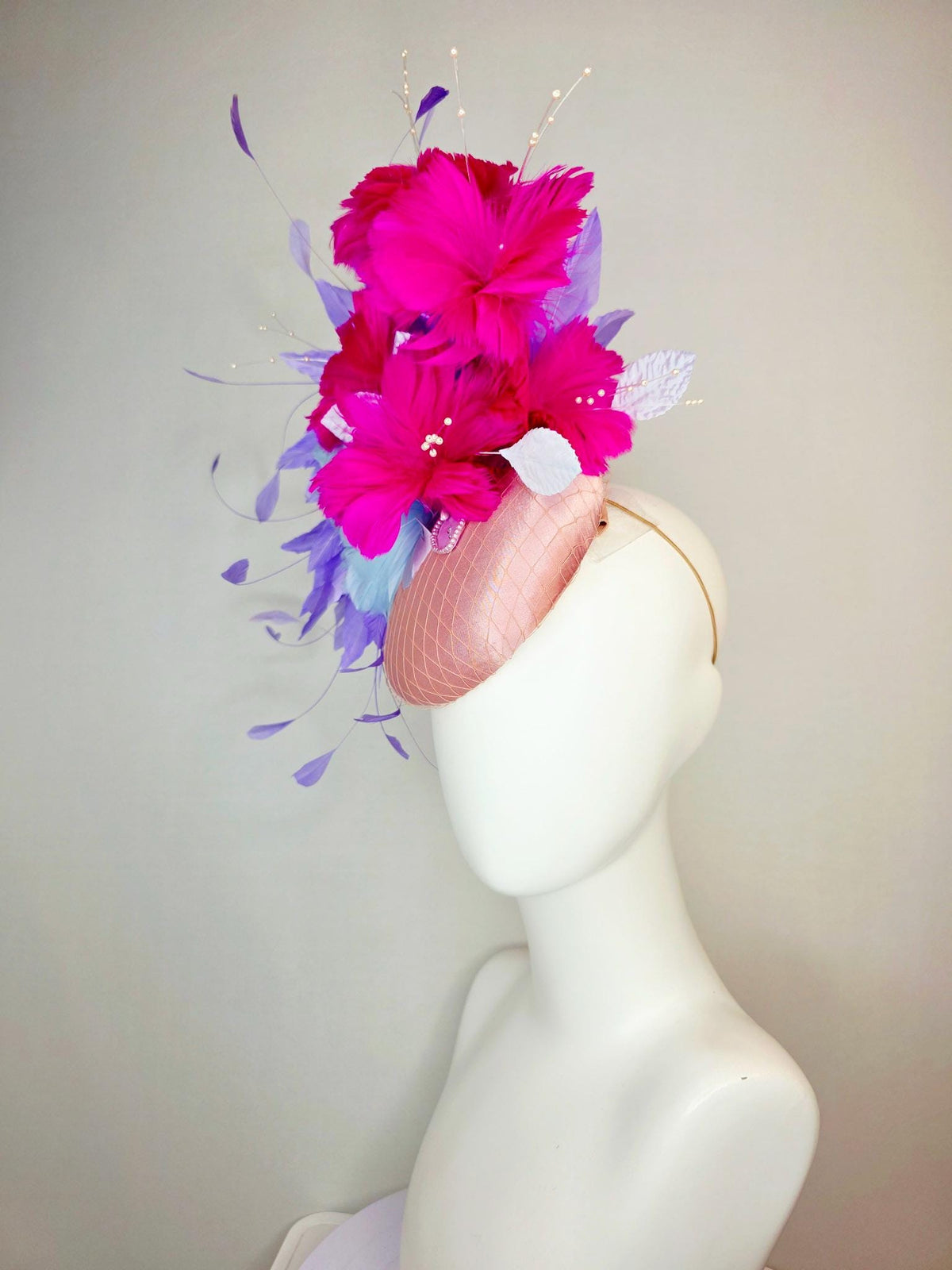 kentucky derby hat fascinator dusty pink satin with netting light blue fuchsia pink feather flowers white leaves lavender purple feathers