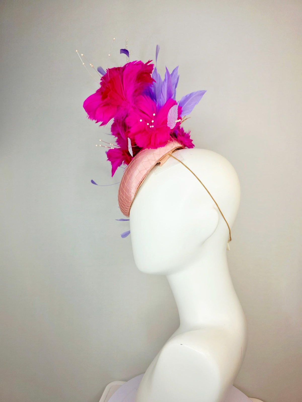 kentucky derby hat fascinator dusty pink satin with netting light blue fuchsia pink feather flowers white leaves lavender purple feathers