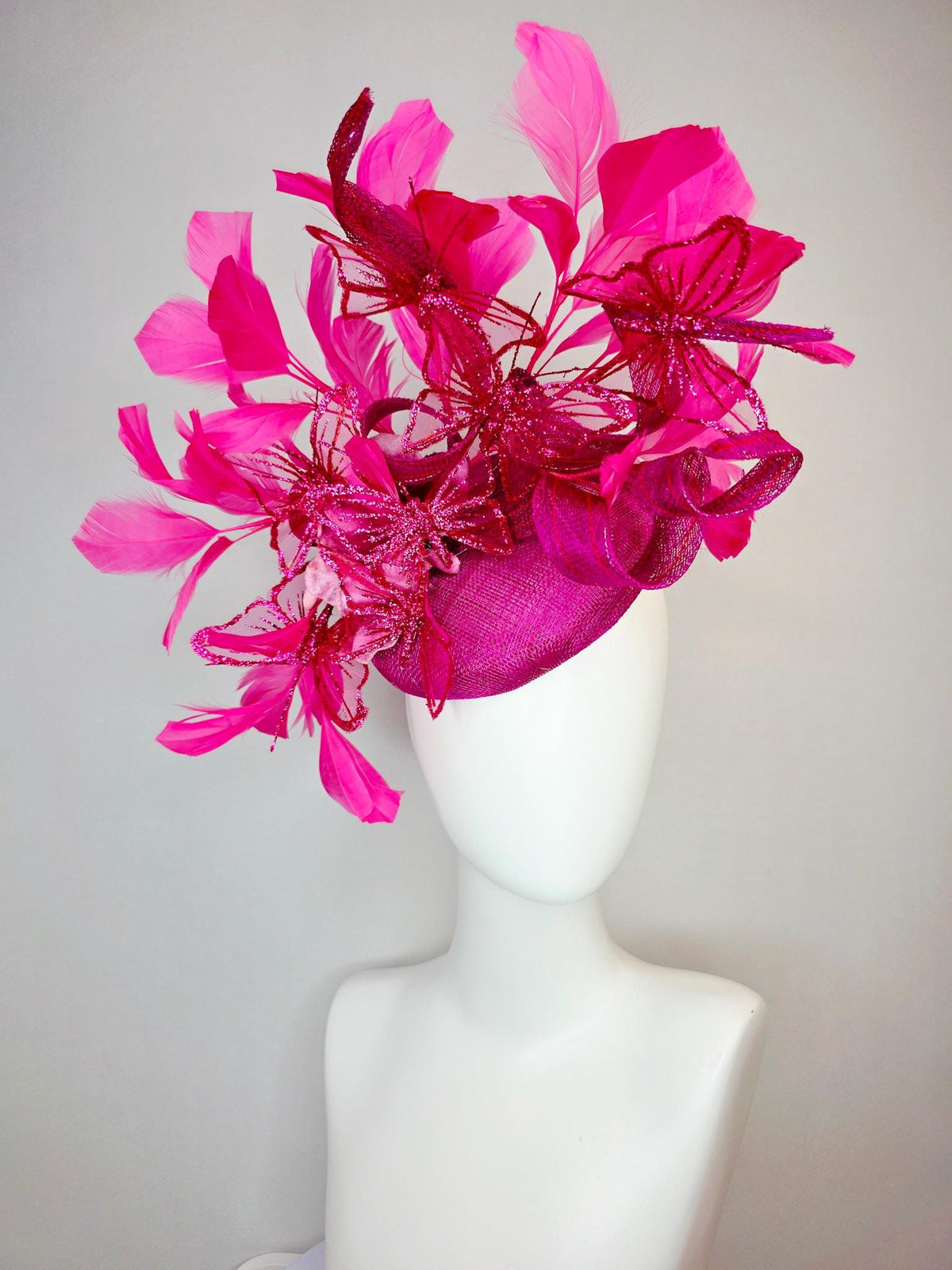 kentucky derby hat fascinator magenta pink sinamay with curls pink ombre satin flowers fuchsia pink feathers hot pink glitter butterflies