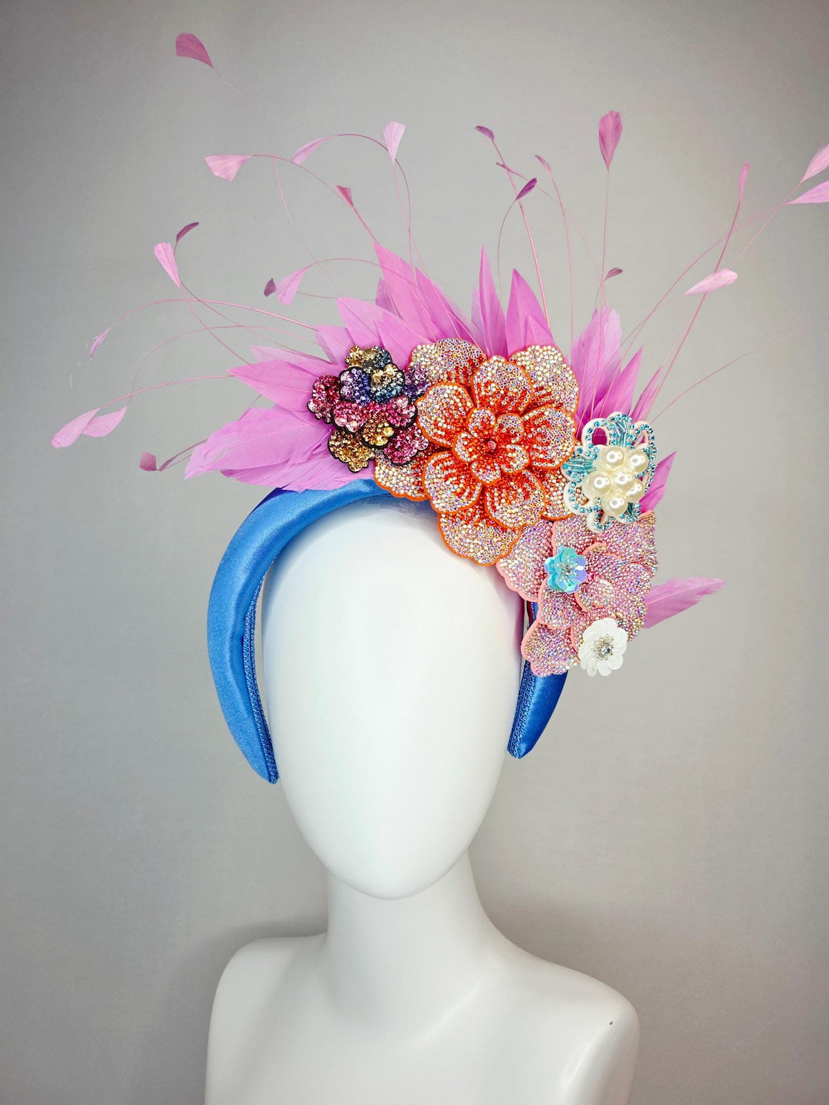 kentucky derby hat fascinator sky blue satin headband with iridescent pink orange blue gold pearl crystal flowers and blush pink feathers