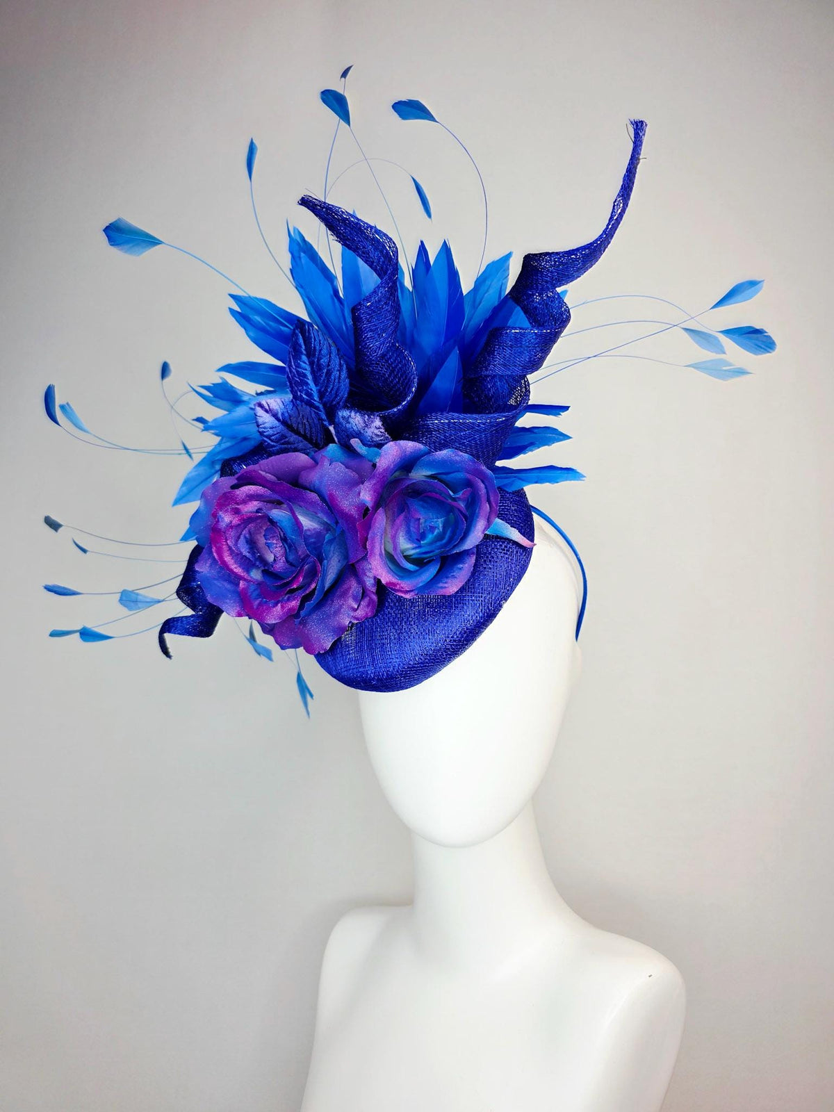 kentucky derby hat fascinator cobalt blue sinamay with curls ombre pink purple blue satin roses blue leaves royal blue branching feathers