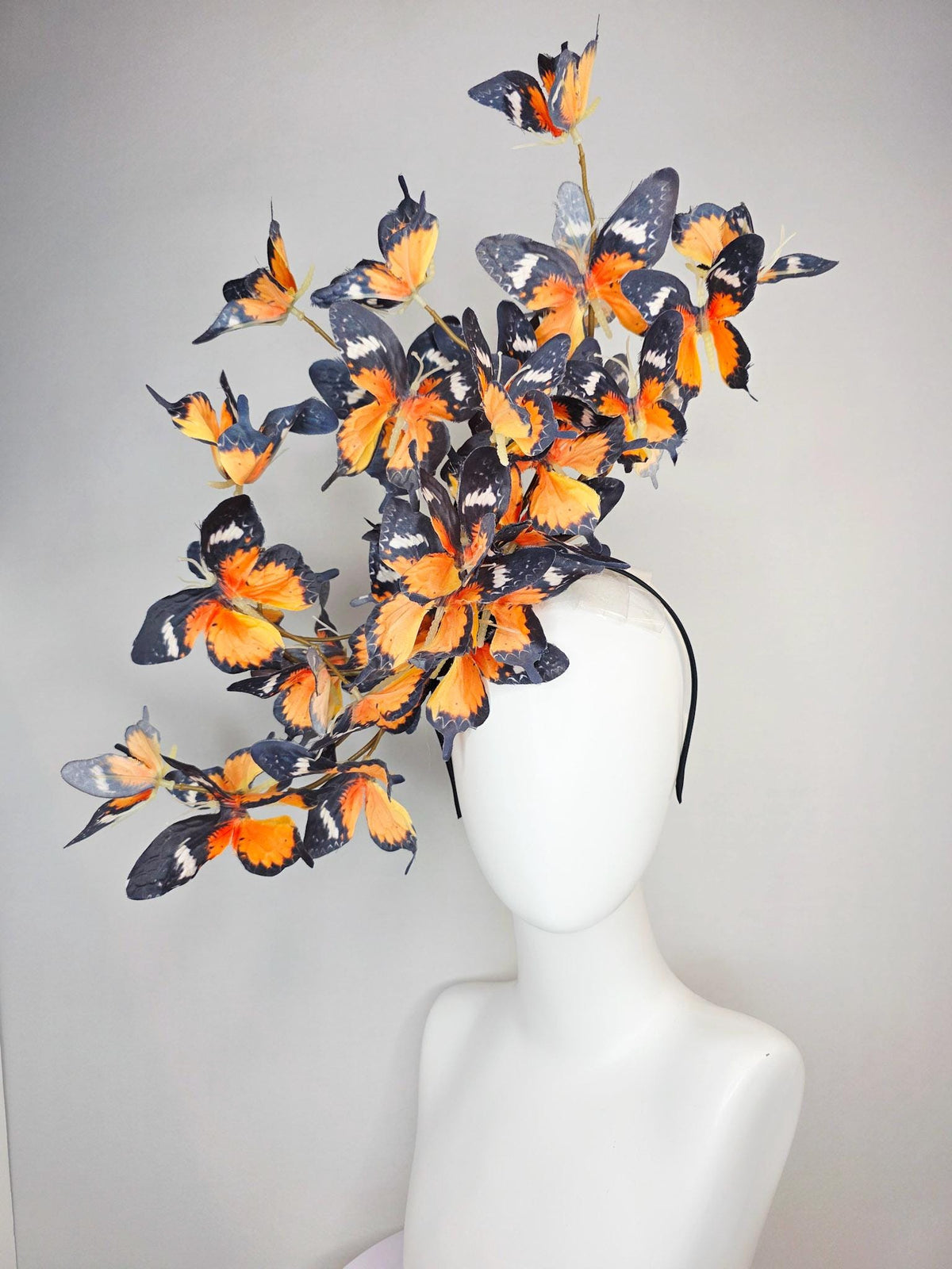 kentucky derby hat fascinator large branching warm burnt orange yellow black and white fabric butterflies on headband