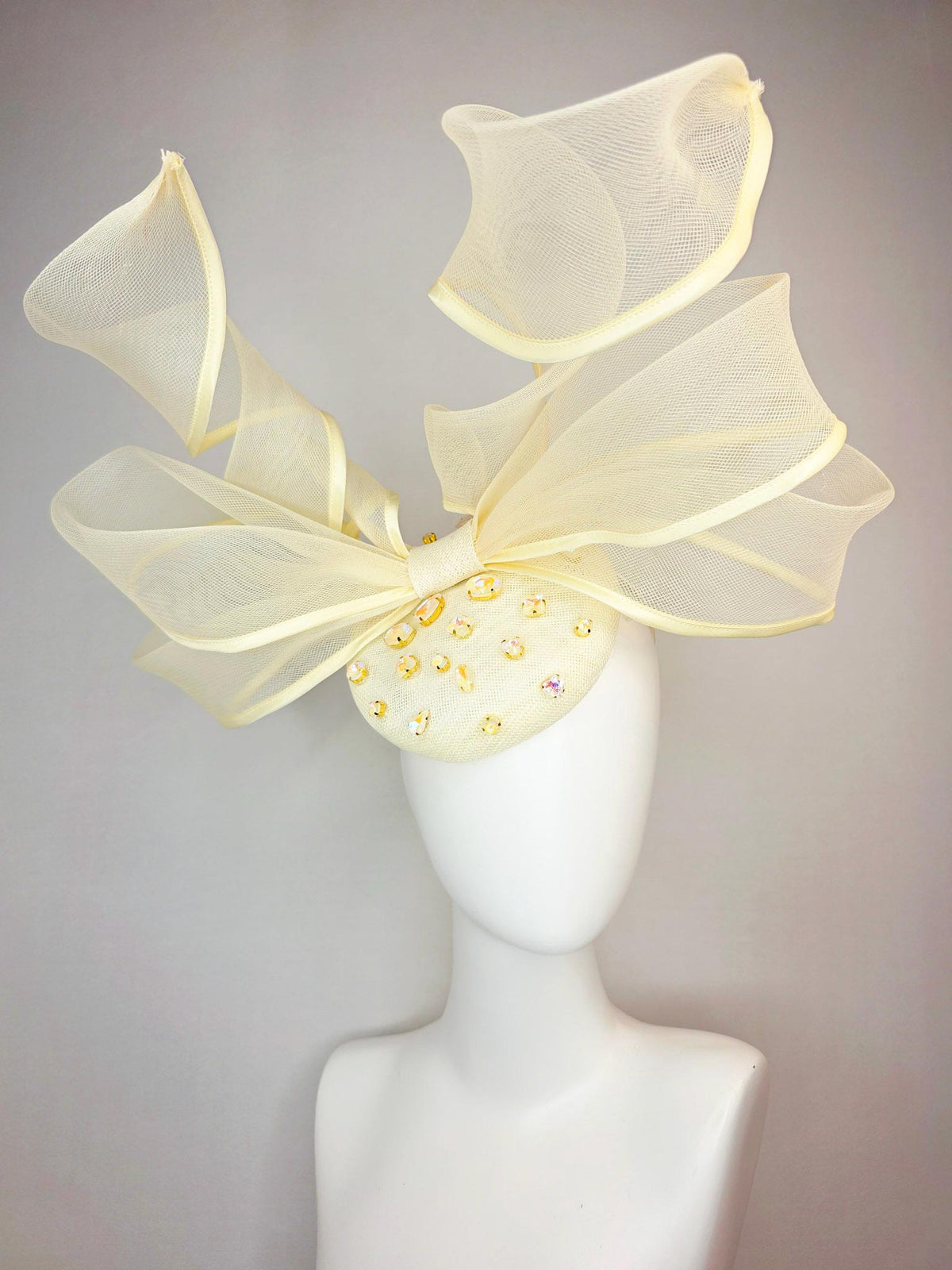 kentucky derby hat fascinator light yellow sinamay base with iridescent yellow crystal jewels mesh wired ribbon large bendable bow decor