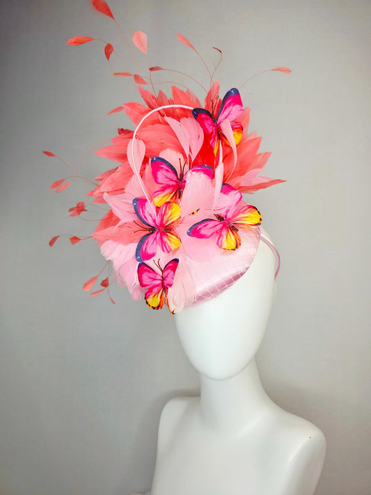 kentucky derby hat fascinator light pink satin with netting baby pink coral orange branching feathers and pink yellow navy blue butterflies