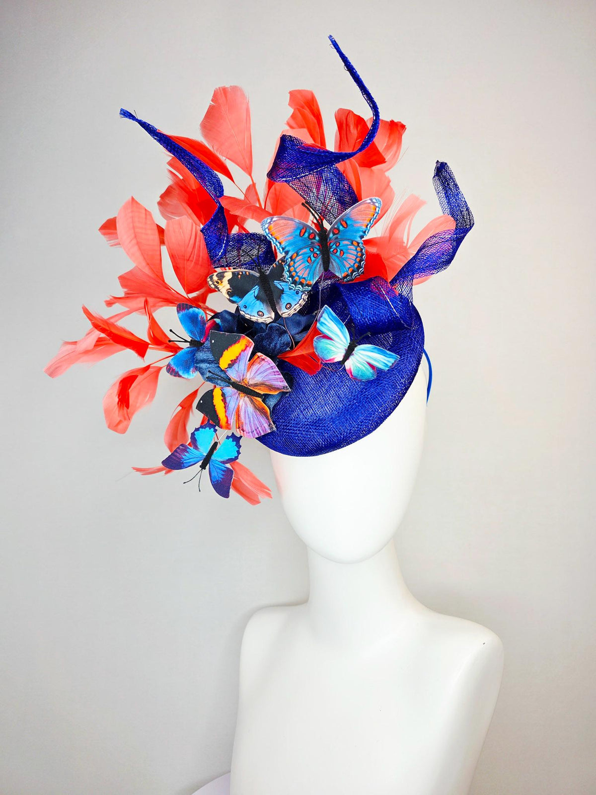kentucky derby hat fascinator cobalt blue sinamay with curls royal blue organza flower coral orange feathers blue yellow black butterflies