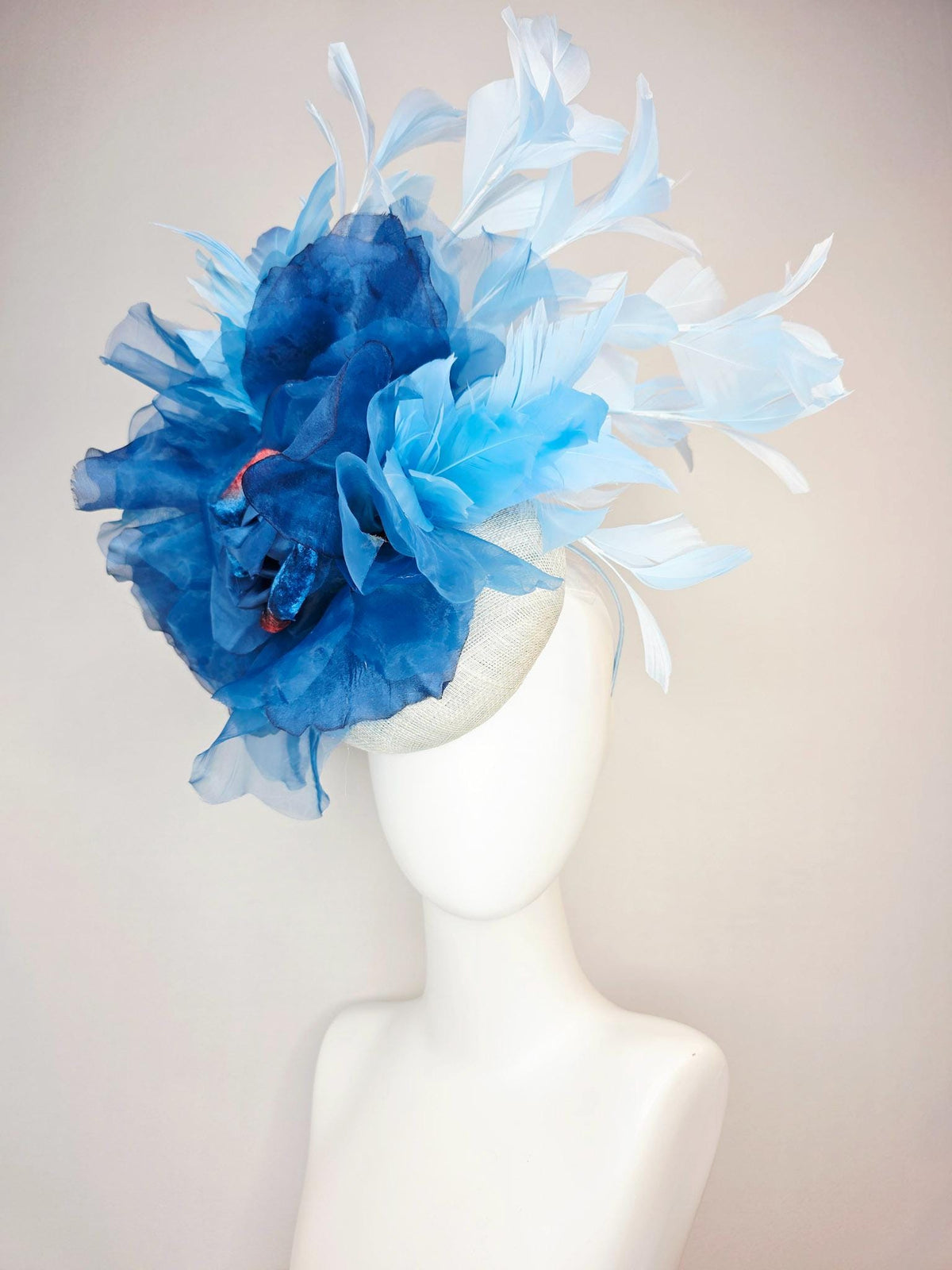 kentucky derby hat fascinator ivory white sinamay with large cobalt royal blue organza flower and light baby sky blue branching feathers