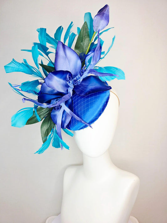 kentucky derby hat fascinator royal blue satin with netting purple cobalt blue satin flower green leaves turquoise blue branching feathers