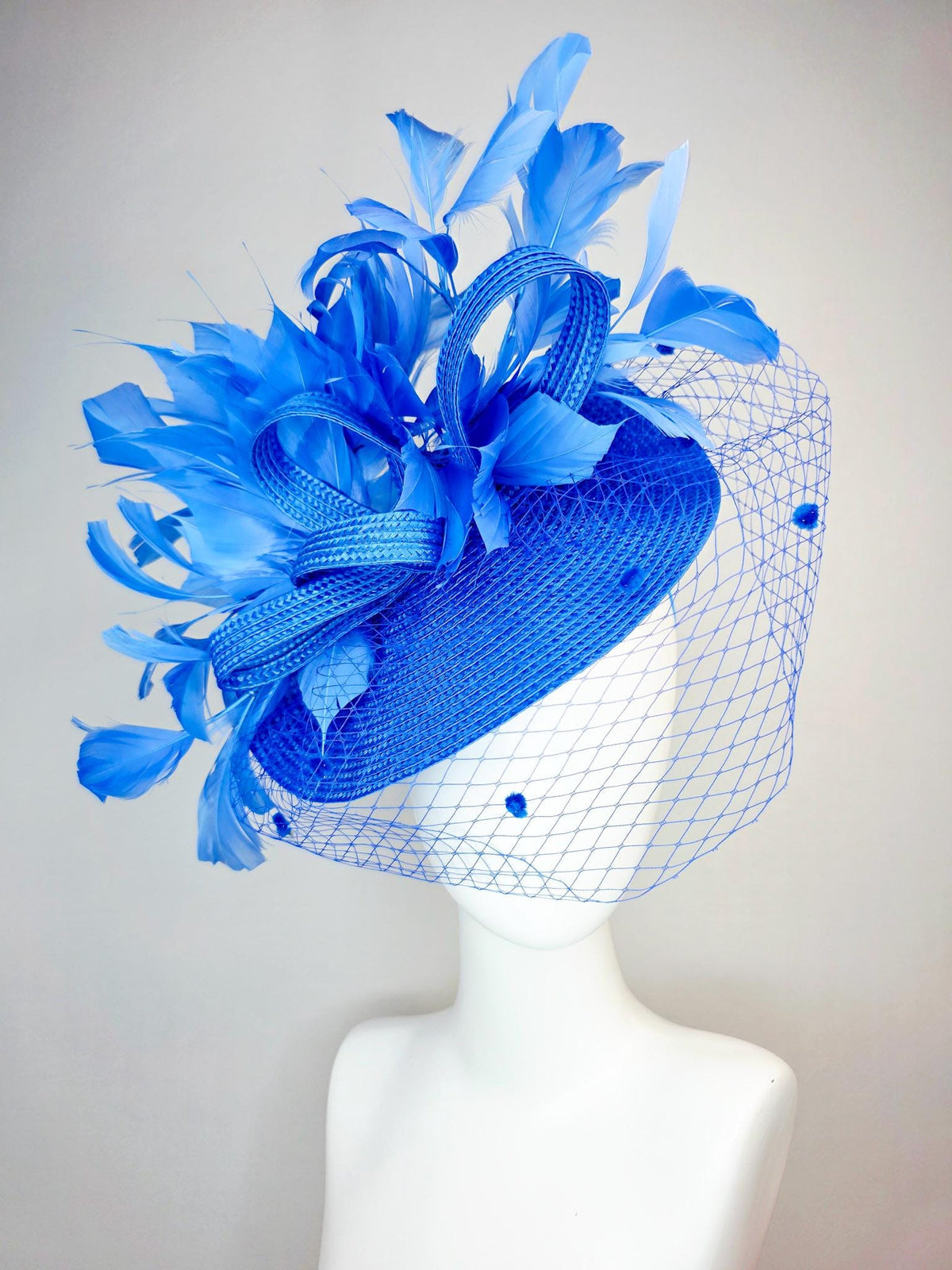 kentucky derby hat fascinator cobalt blue straw saucer with cobalt blue straw bow royal blue feathers and cobalt blue mesh veil