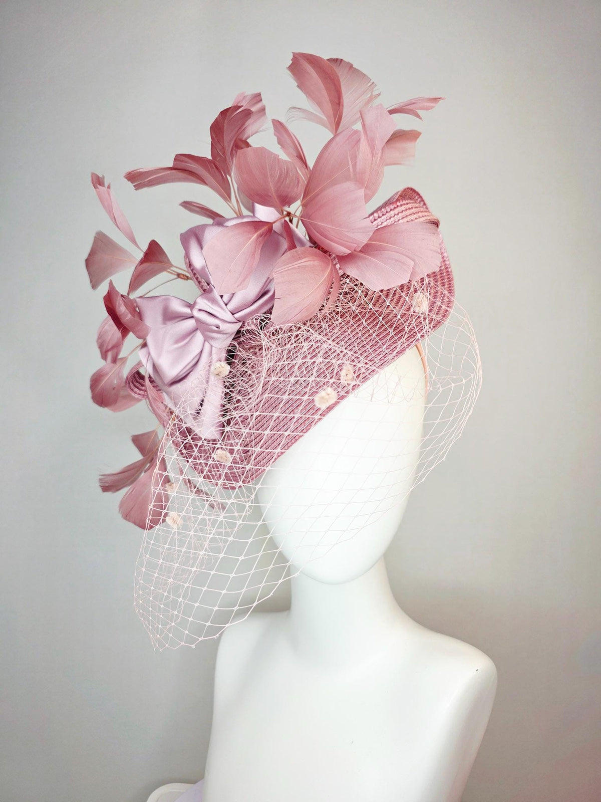 kentucky derby hat fascinator dusty mauve pink straw saucer with lilac pink satin bow dusty pink branching feathers light pink mesh veil
