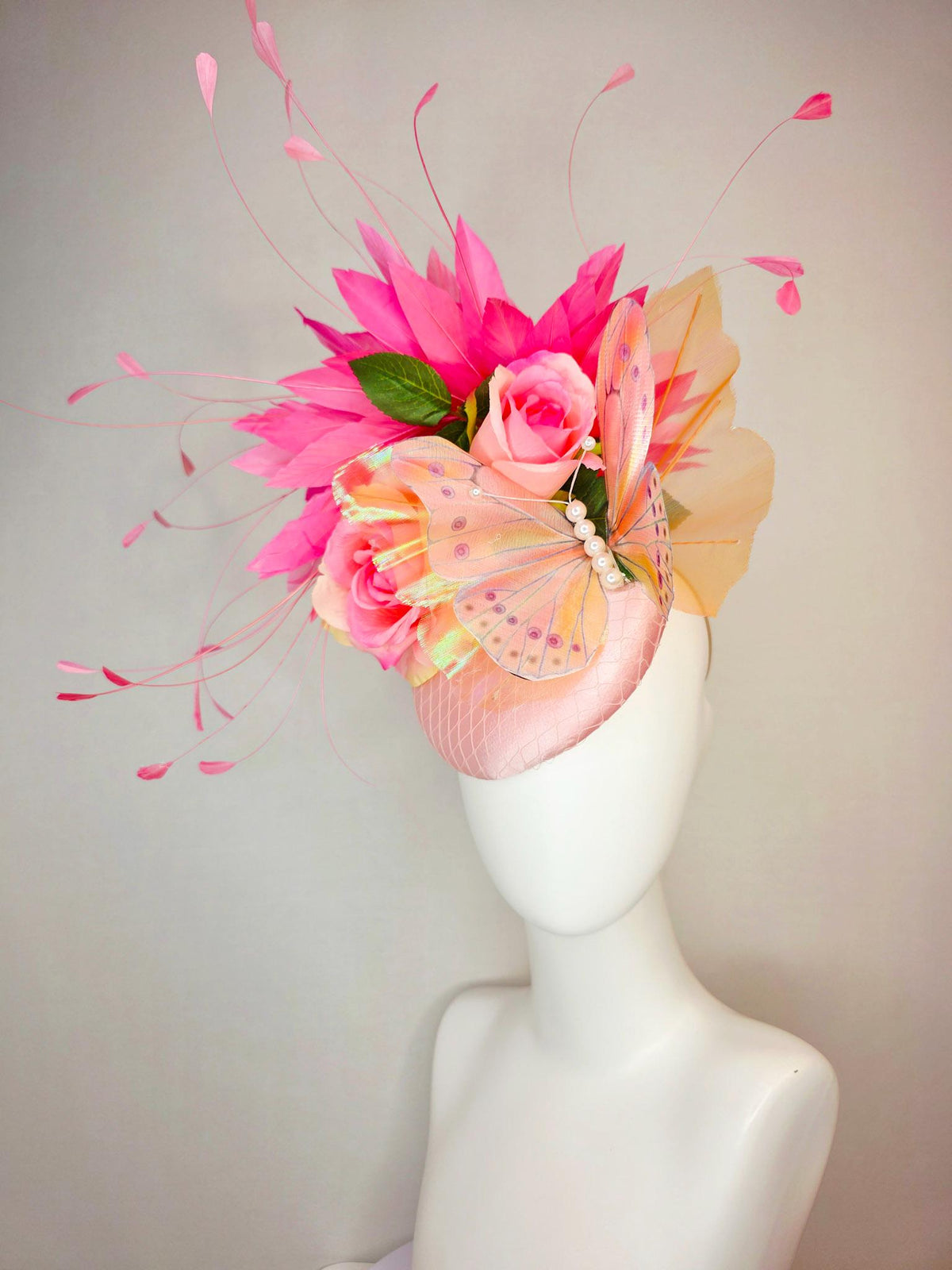kentucky derby hat fascinator light pink satin with netting ombre peach yellow pink satin roses green leaves pink feathers large butterfly