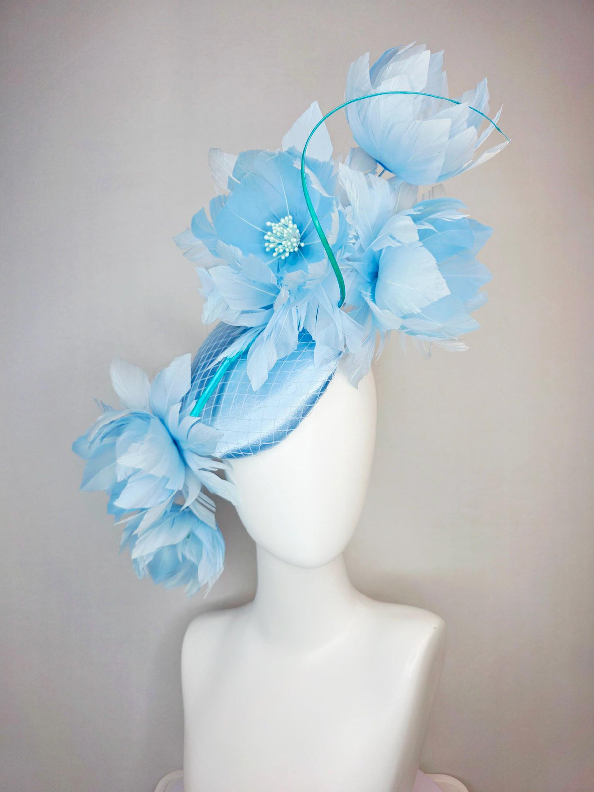 kentucky derby hat fascinator light blue satin with netting and large fluffy sky blue feather flowers and baby blue feathers