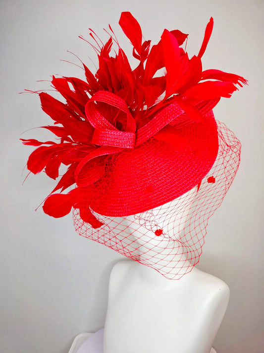 kentucky derby hat fascinator scarlet red straw saucer with red straw bow with bright red branching feathers and red mesh veil