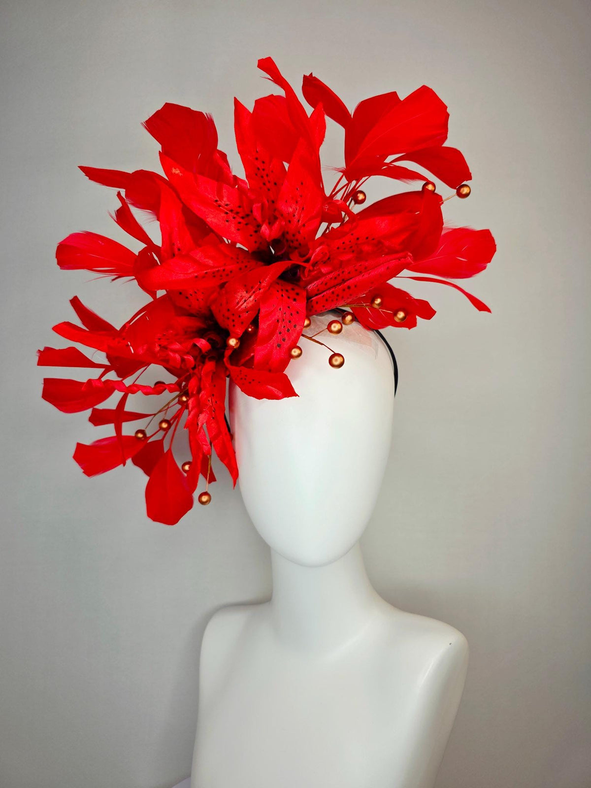 kentucky derby hat fascinator bright scarlet red satin lily flowers with gold pearls and bright red branching feathers