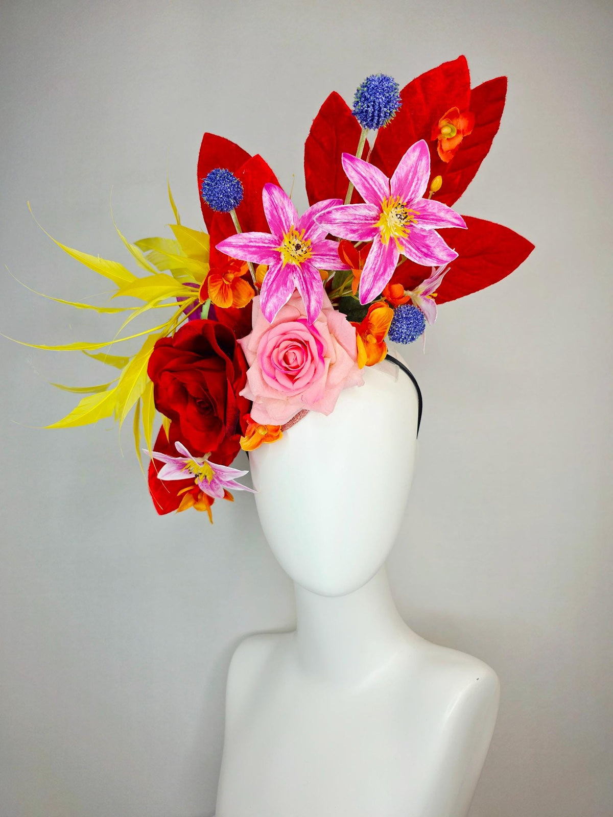 kentucky derby hat fascinator red light pink satin roses orange red pink magenta purple flowers blue thistle red leaves and yellow feathers