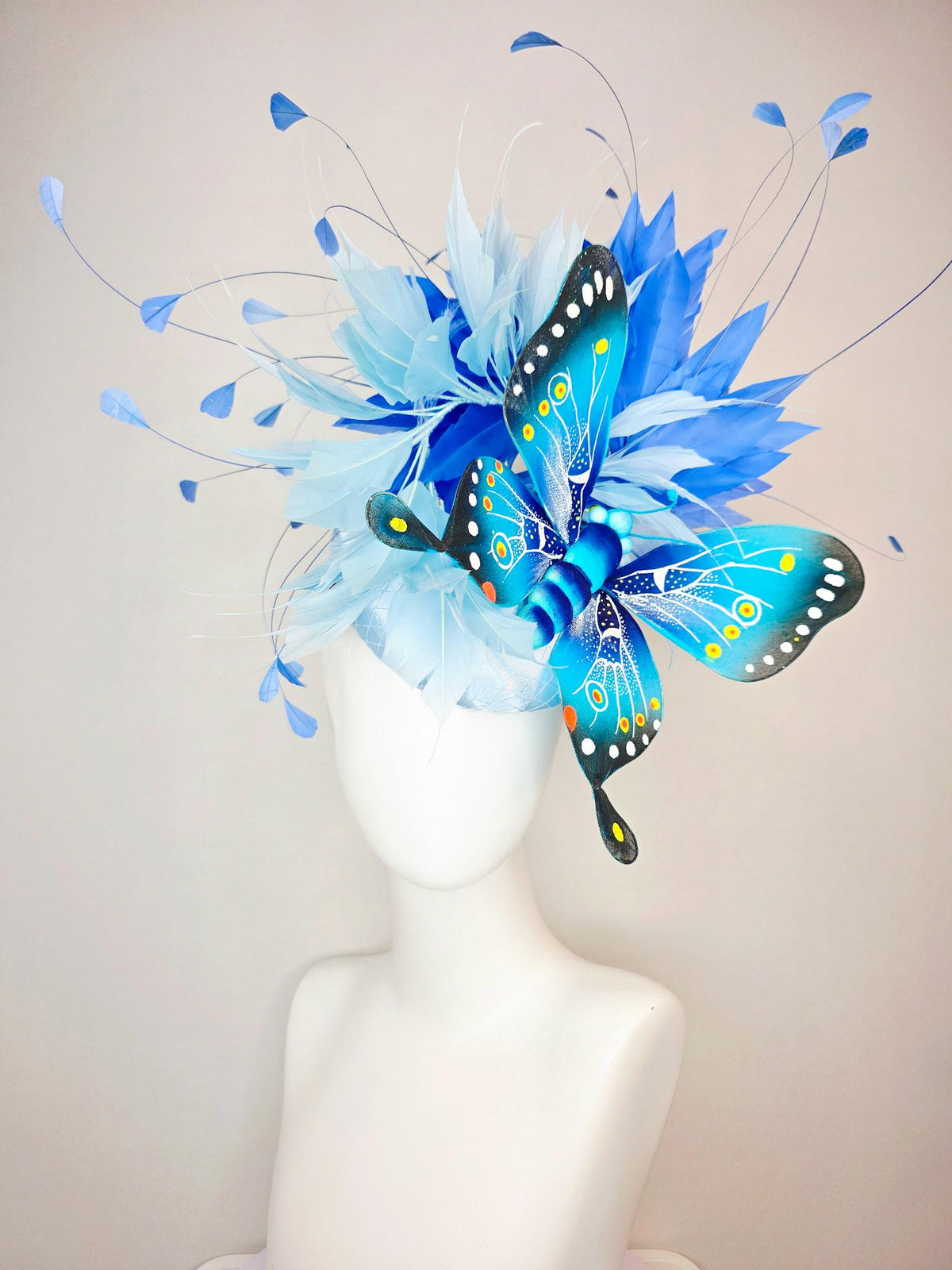 kentucky derby hat fascinator baby blue satin with netting light blue cobalt blue branching feathers large turquoise blue black butterfly
