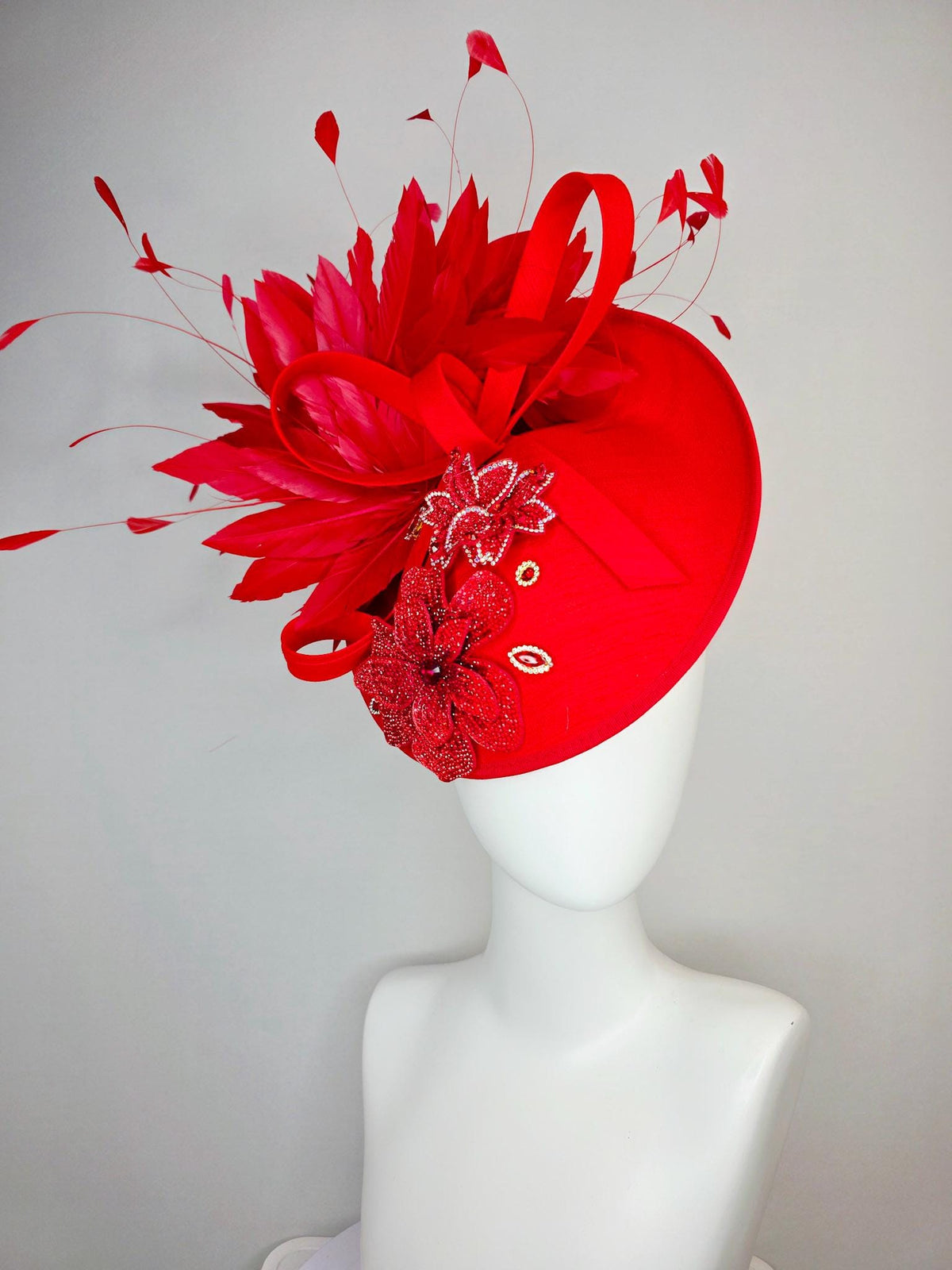 kentucky derby hat fascinator bright red shantung saucer with shantung bow red crystal rhinestone flowers scarlert red branching feathers