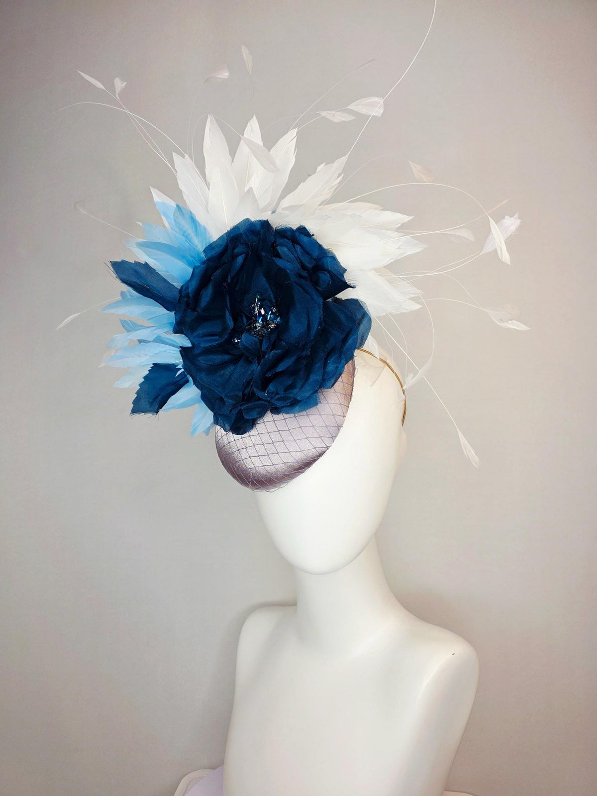 kentucky derby hat fascinator silver gray satin with netting large navy blue organza rose flower with sky blue and white branching feathers
