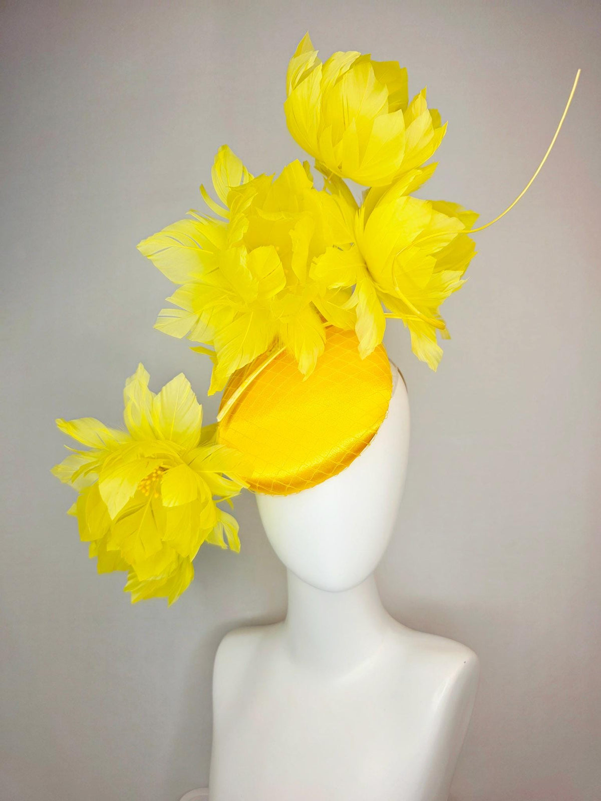 kentucky derby hat fascinator gold yellow satin with netting and large fluffy yellow feather flowers and yellow feathers