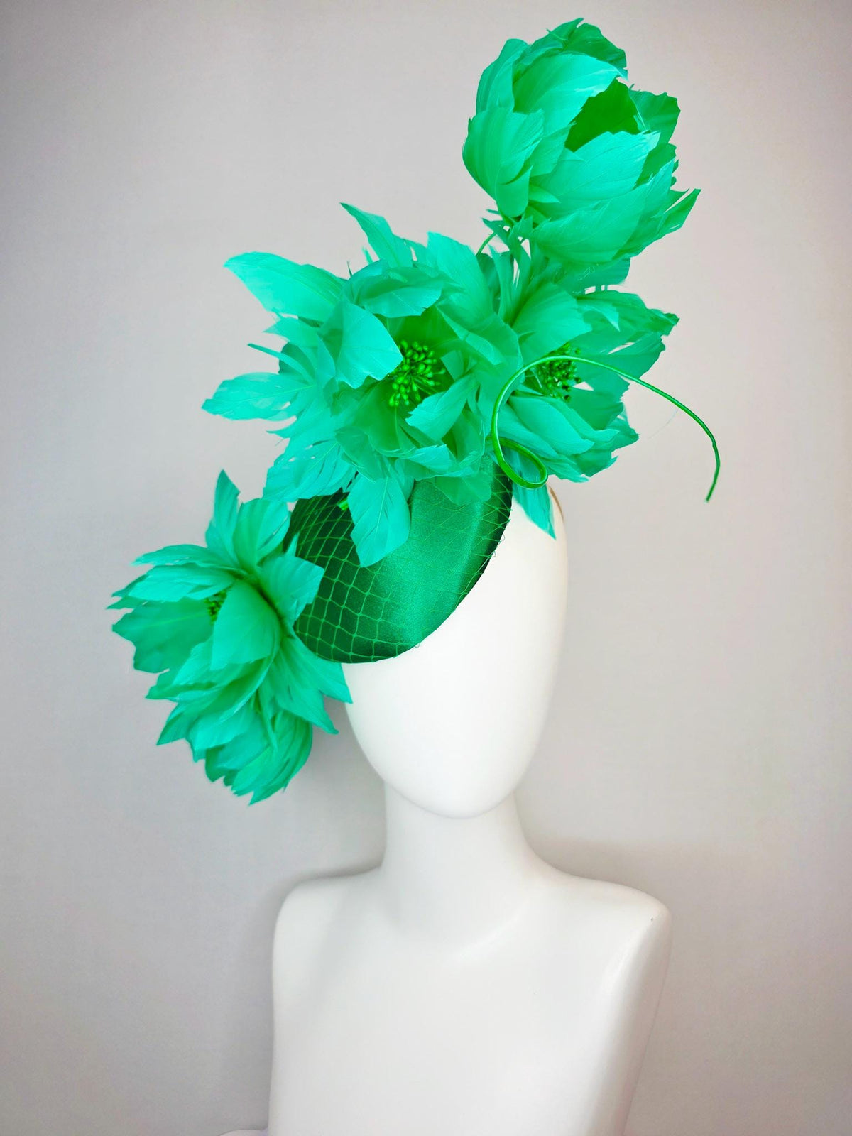kentucky derby hat fascinator emerald green satin with netting and large fluffy green feather flowers and green feathers