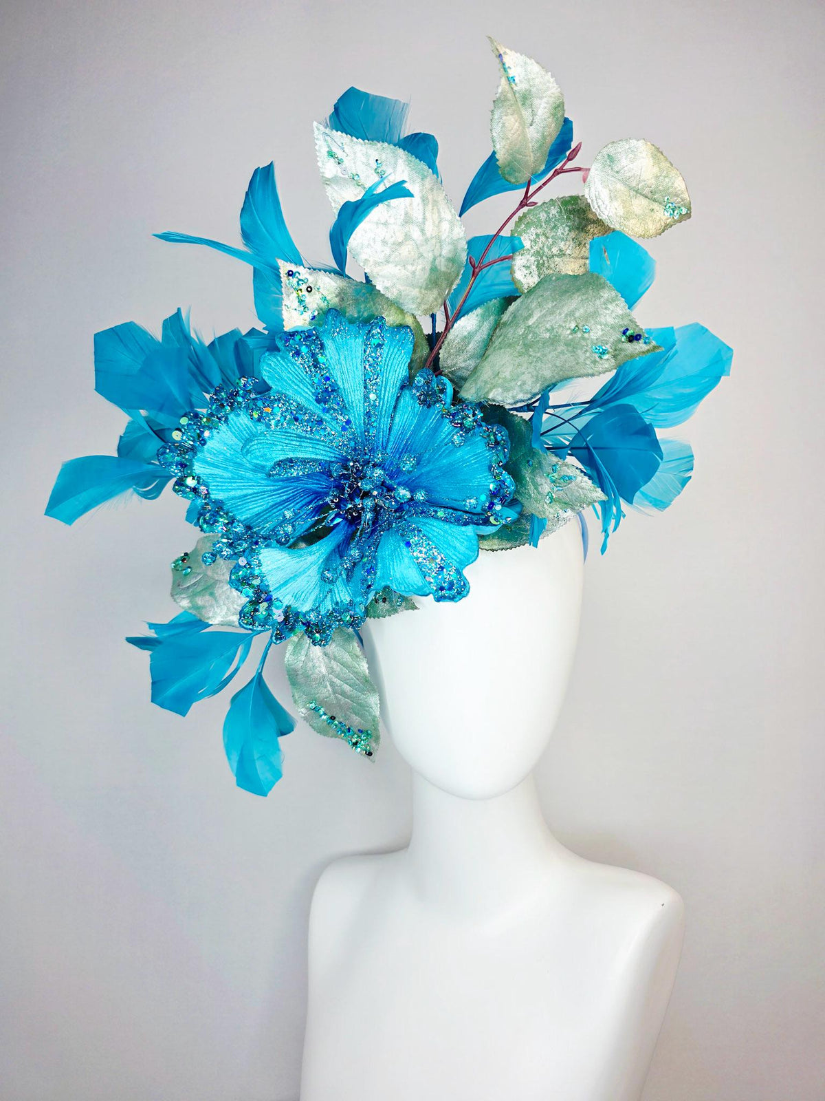 kentucky derby hat fascinator large with sky ocean blue satin flower with sequin silver sage green leaves turquoise blue branching feathers