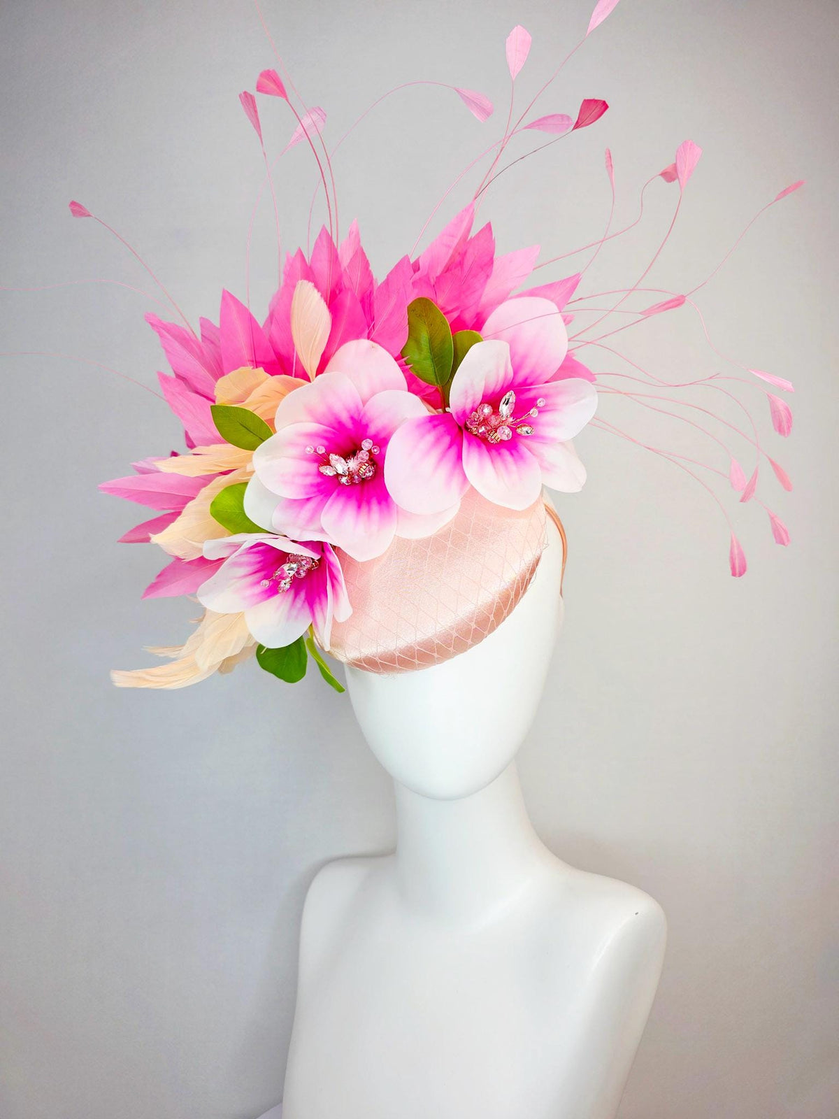 kentucky derby hat fascinator light pink satin with netting pink white satin flowers green leaves cream beige and hot pink fluffy feathers